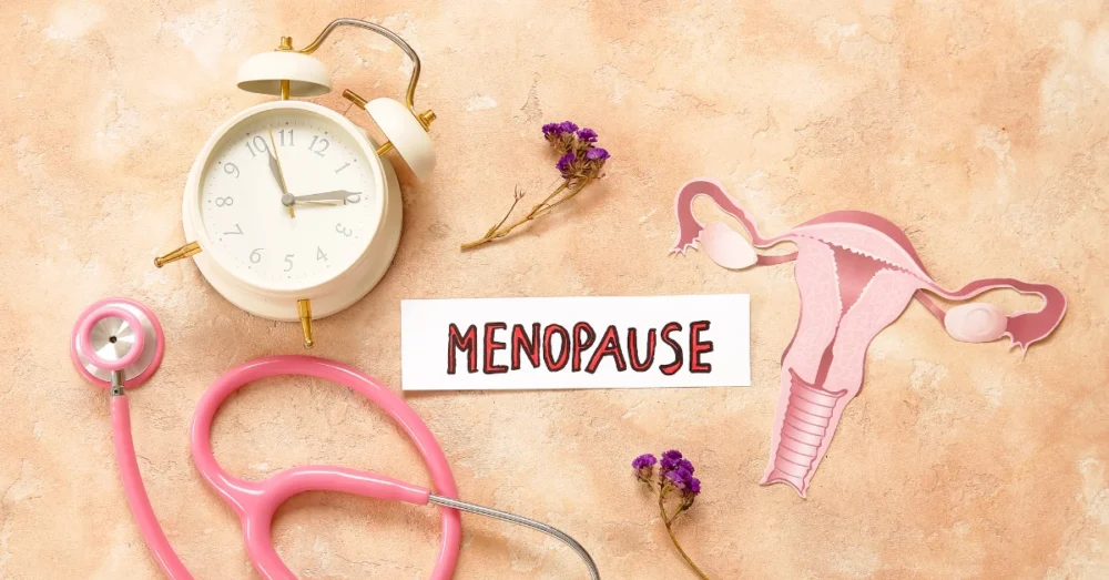 Menopause concept with clock, stethoscope, and uterus illustration symbolising hormonal changes and women's health.